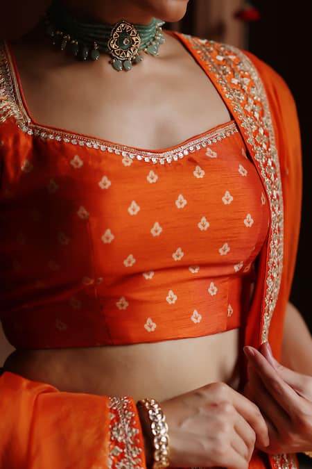 Megha Pitti_Orange Silk Lace, Sequins Sweetheart Neck Bloom Print Lehenga Set _Online_at_Aza_Fashions