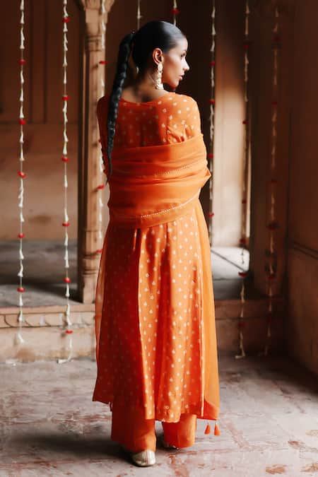 Shop Megha Pitti Orange Silk, Organza Embroidery, Sequins Clover Bloom Print Yoke Kurta Pant Set at Aza Fashions Shop_Megha Pitti_Orange Silk, Organza Embroidery, Sequins Clover Bloom Print Yoke Kurta Pant Set _at_Aza_Fashions