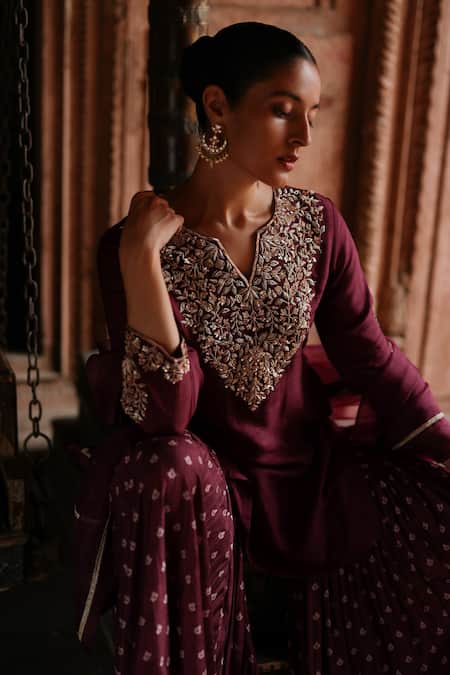 Megha Pitti Wine Silk Embroidery Split V-neck Fleur Kurta Sharara Set at Aza Fashions Megha Pitti_Wine Silk Embroidery Split V-neck Fleur Kurta Sharara Set _at_Aza_Fashions