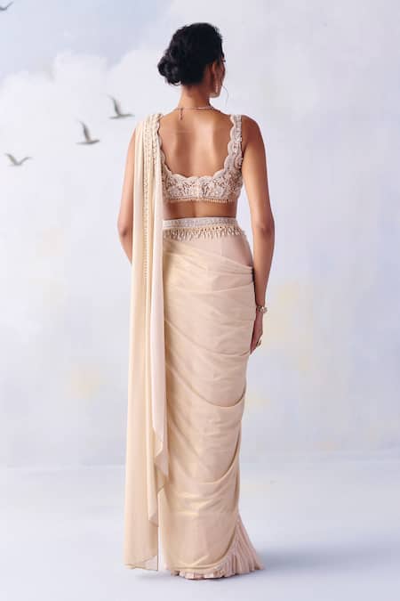Shop Awigna Ivory Chiffon, Emma Meadow Embroidered Border Pre-draped Saree With Blouse at Aza Fashions Shop_Awigna_Ivory Chiffon, Emma Meadow Embroidered Border Pre-draped Saree With Blouse _at_Aza_Fashions
