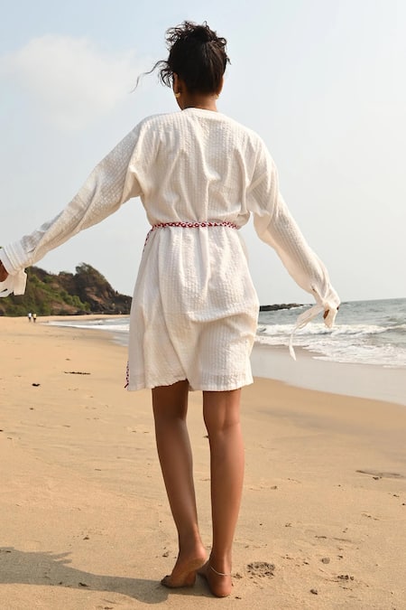 Shop Shop Nirvanaa White Cotton Bows Round Neck Ivy Mini Dress at Aza Fashions Shop_Shop Nirvanaa_White Cotton Bows Round Neck Ivy Mini Dress _at_Aza_Fashions