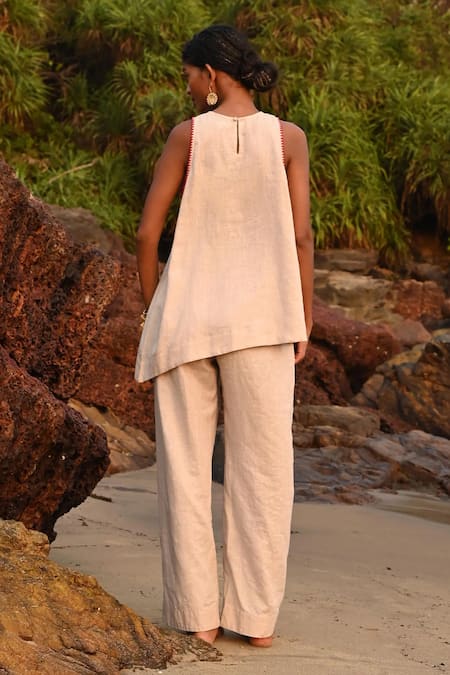 Shop Shop Nirvanaa Beige Linen Embroidery Round Neck Lauren Asymmetrical Top at Aza Fashions Shop_Shop Nirvanaa_Beige Linen Embroidery Round Neck Lauren Asymmetrical Top _at_Aza_Fashions