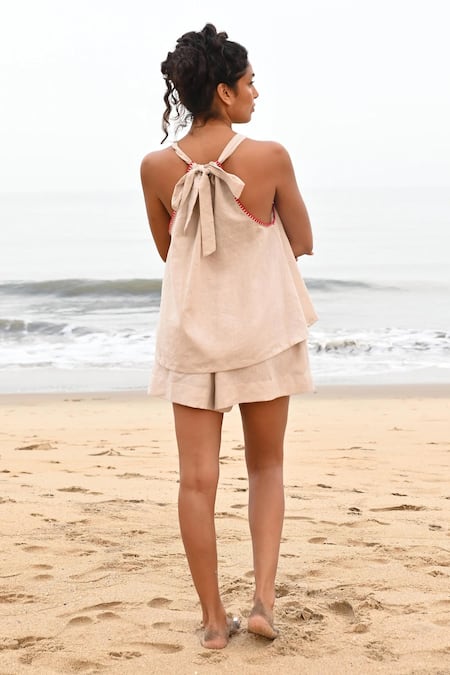 Shop Shop Nirvanaa Beige Linen Embroidery Halter Neck Noir Tie-up Top at Aza Fashions Shop_Shop Nirvanaa_Beige Linen Embroidery Halter Neck Noir Tie-up Top _at_Aza_Fashions