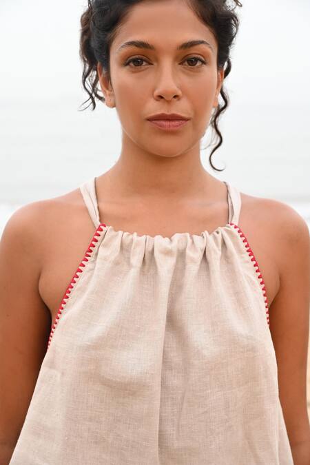 Buy Shop Nirvanaa Beige Linen Embroidery Halter Neck Noir Tie-up Top Online at Aza Fashions Buy_Shop Nirvanaa_Beige Linen Embroidery Halter Neck Noir Tie-up Top _Online_at_Aza_Fashions