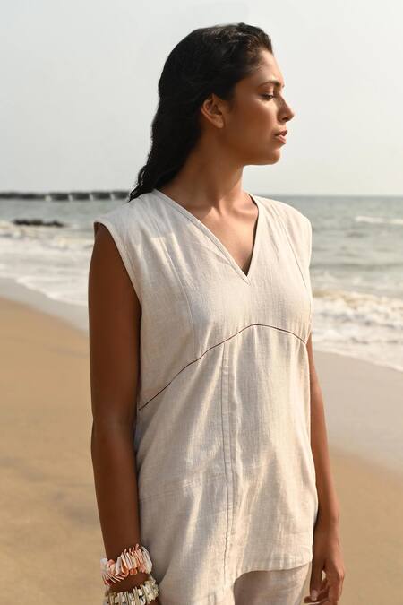 Shop Nirvanaa_Beige Linen Embroidery V-neck Roseline Top_Online_at_Aza_Fashions