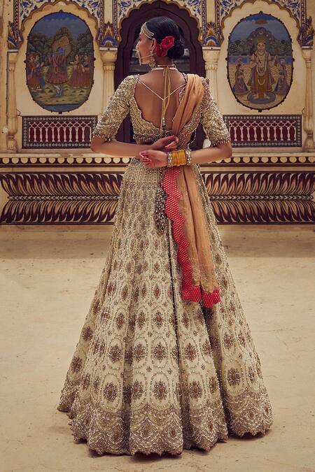 Nitika Gujral Gold Net, Tissue Crystals, Pearls, Beads Resham Embroidered Bridal Lehenga Set at Aza Fashions Nitika Gujral_Gold Net, Tissue Crystals, Pearls, Beads Resham Embroidered Bridal Lehenga Set _at_Aza_Fashions