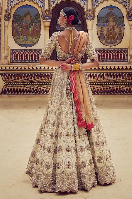 Shop Nitika Gujral Gold Net, Tissue Pearls, Beads, Crystals, Resham Embroidered Bridal Lehenga Set at Aza Fashions Shop_Nitika Gujral_Gold Net, Tissue Pearls, Beads, Crystals, Resham Embroidered Bridal Lehenga Set _at_Aza_Fashions