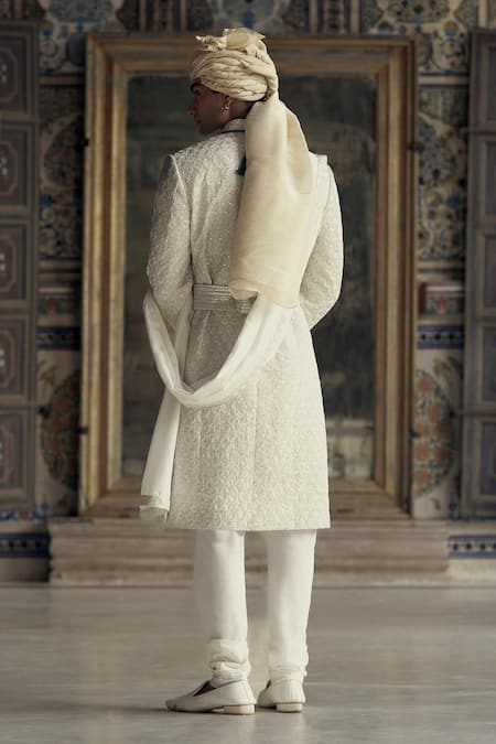 Shop Nitika Gujral Ivory Silk Sequins, Diamonds, Beads Dabka Embroidered Sherwani And Kurta Set at Aza Fashions Shop_Nitika Gujral_Ivory Silk Sequins, Diamonds, Beads Dabka Embroidered Sherwani And Kurta Set _at_Aza_Fashions