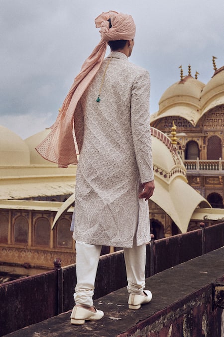 Shop Nitika Gujral White Silk Crystals, Beads, Zari Gold Embroidered Sherwani Set at Aza Fashions Shop_Nitika Gujral_White Silk Crystals, Beads, Zari Gold Embroidered Sherwani Set _at_Aza_Fashions