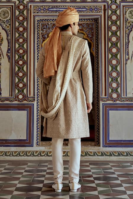 Shop Nitika Gujral Beige Silk Cut Work, Embroidery Resham Dabka Sherwani Churidar Set at Aza Fashions Shop_Nitika Gujral_Beige Silk Cut Work, Embroidery Resham Dabka Sherwani Churidar Set _at_Aza_Fashions