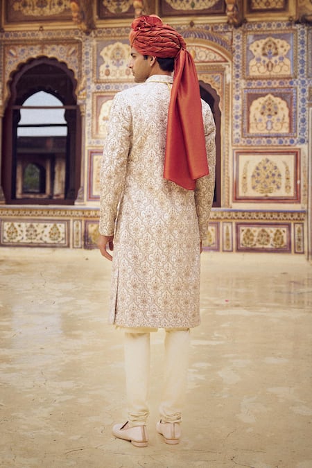 Shop Nitika Gujral Beige Silk Beads, Crystals, Diamonds Kasab Embroidered Sherwani Set at Aza Fashions Shop_Nitika Gujral_Beige Silk Beads, Crystals, Diamonds Kasab Embroidered Sherwani Set _at_Aza_Fashions