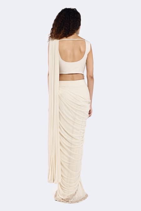 Shop Onaya Ivory Lycra Sequins, Cut Attached Embellished Sash Pre-draped Saree With Blouse at Aza Fashions Shop_Onaya_Ivory Lycra Sequins, Cut Attached Embellished Sash Pre-draped Saree With Blouse _at_Aza_Fashions