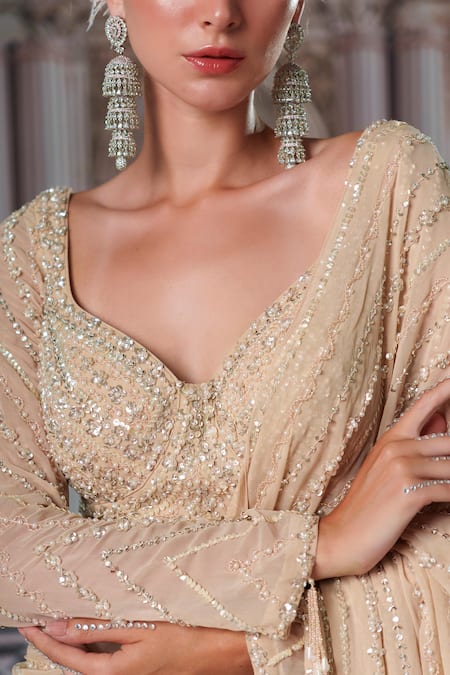 Nidhika Shekhar_Gold Georgette, Silk Sequins, Celestial Embroidered Pre-draped Saree With Blouse _at_Aza_Fashions