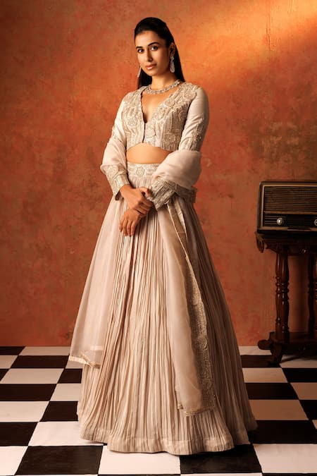 Rishi And Soujit_Ivory Crepe, Organza Embroidery, Pearls, Pleated Lehenga And Short Jacket Set _Online_at_Aza_Fashions