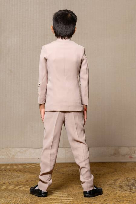 Shop Kirti Agarwal - Pret N Couture Beige Silk Cut Work, Pearls Cutdana Embellished Bandhgala And Pant Set at Aza Fashions Shop_Kirti Agarwal - Pret N Couture_Beige Silk Cut Work, Pearls Cutdana Embellished Bandhgala And Pant Set _at_Aza_Fashions