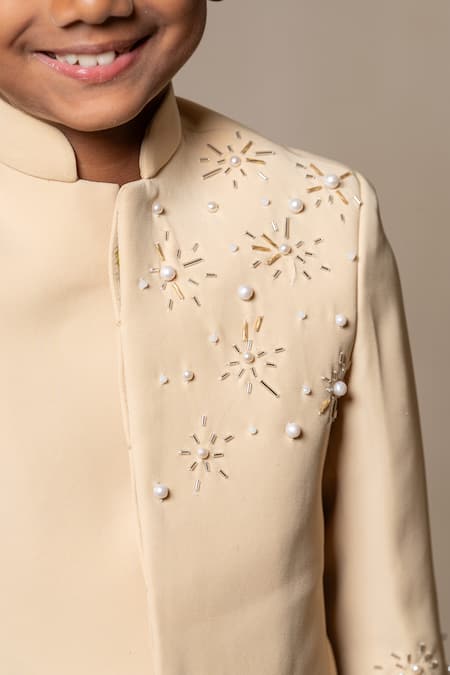 Shop Kirti Agarwal - Pret N Couture Yellow Silk Cut Work, Pearls Cutdana Embellished Bandhgala And Pant Set Online at Aza Fashions Shop_Kirti Agarwal - Pret N Couture_Yellow Silk Cut Work, Pearls Cutdana Embellished Bandhgala And Pant Set _Online_at_Aza_Fashions