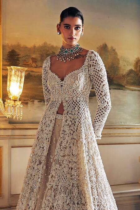 Seema Gujral Ivory Net Pearls, Embroidery, Tassels, Sequins Longline Jacket Lehenga Set Online at Aza Fashions Seema Gujral_Ivory Net Pearls, Embroidery, Tassels, Sequins Longline Jacket Lehenga Set _Online_at_Aza_Fashions