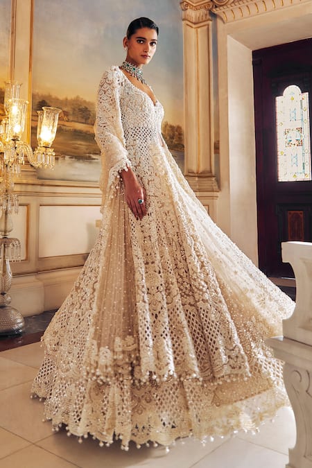 Shop Seema Gujral Ivory Net Pearls, Embroidery, Tassels, Sequins Longline Jacket Lehenga Set Online at Aza Fashions Shop_Seema Gujral_Ivory Net Pearls, Embroidery, Tassels, Sequins Longline Jacket Lehenga Set _Online_at_Aza_Fashions