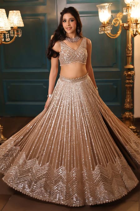 Shop Isa By Dolly Wahal Gold Net Crystal Embellished Slit Lehenga Set Online at Aza Fashions Shop_Isa By Dolly Wahal_Gold Net Crystal Embellished Slit Lehenga Set _Online_at_Aza_Fashions