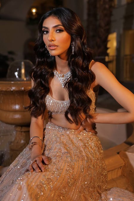 Isa By Dolly Wahal_Gold Net Crystals, Sequins, Beads Scoop Feather Embellished Bridal Lehenga Set _at_Aza_Fashions