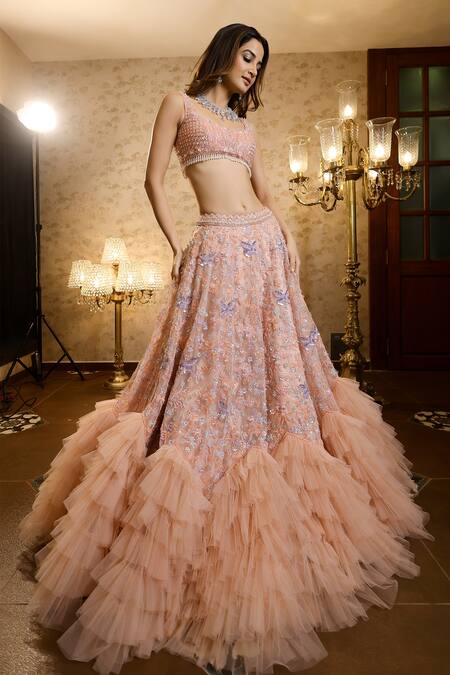 Isa By Dolly Wahal_Peach Net Crystals, Floral Butterfly Embellished Ruffle Bridal Lehenga Set_at_Aza_Fashions