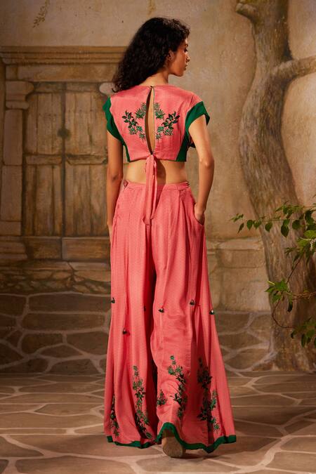 Shop Basil Leaf Pink Chiffon Tassels, Mirrors Tropical Embroidered Twisted Top With Flared Pant at Aza Fashions Shop_Basil Leaf_Pink Chiffon Tassels, Mirrors Tropical Embroidered Twisted Top With Flared Pant_at_Aza_Fashions