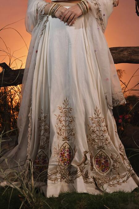 Buy Ishram Couture Ivory Chanderi, Silk Organza, Handloom Cotton Sadhvi Embroidered Lehenga Set Online at Aza Fashions Buy_Ishram Couture_Ivory Chanderi, Silk Organza, Handloom Cotton Sadhvi Embroidered Lehenga Set _Online_at_Aza_Fashions