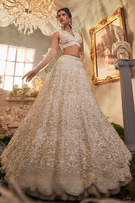 Shop Sunita Bhandari Ivory Tulle, Silk Pearls, Beads, Embroidery V-neck Lumina Lehenga Set at Aza Fashions Shop_Sunita Bhandari_Ivory Tulle, Silk Pearls, Beads, Embroidery V-neck Lumina Lehenga Set _at_Aza_Fashions