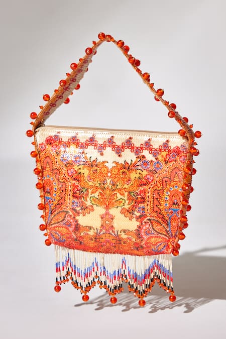 Shop The Garnish Company Yellow Printed Maya Floral Swirl Tassel Potli at Aza Fashions Shop_The Garnish Company_Yellow Printed Maya Floral Swirl Tassel Potli _at_Aza_Fashions