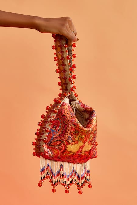 The Garnish Company Yellow Printed Maya Floral Swirl Tassel Potli Online at Aza Fashions The Garnish Company_Yellow Printed Maya Floral Swirl Tassel Potli _Online_at_Aza_Fashions