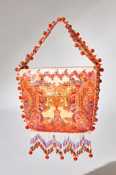 Buy The Garnish Company Yellow Printed Maya Floral Swirl Tassel Potli Online at Aza Fashions Buy_The Garnish Company_Yellow Printed Maya Floral Swirl Tassel Potli _Online_at_Aza_Fashions