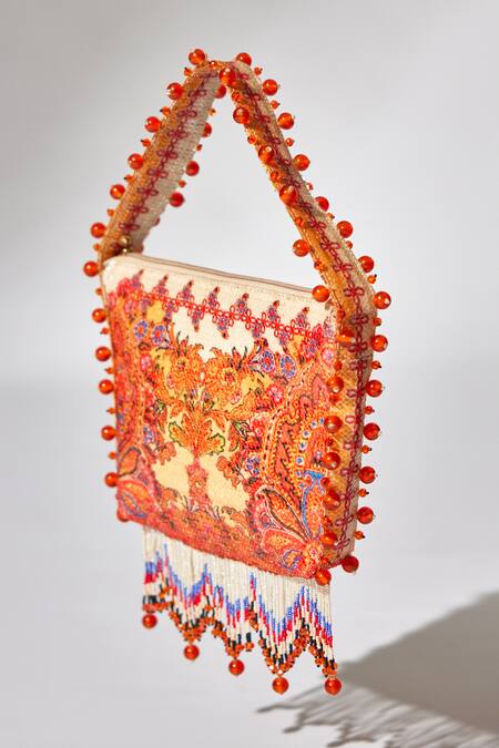 Shop The Garnish Company Yellow Printed Maya Floral Swirl Tassel Potli Online at Aza Fashions Shop_The Garnish Company_Yellow Printed Maya Floral Swirl Tassel Potli _Online_at_Aza_Fashions