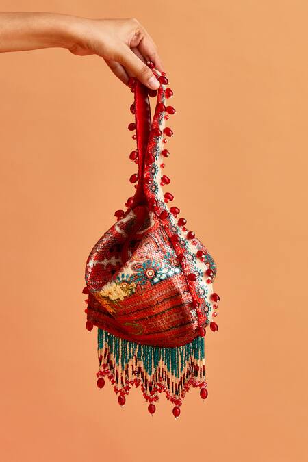 The Garnish Company_Blue Printed Crisann Floral Tassel Potli _Online_at_Aza_Fashions