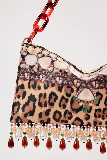 The Garnish Company_Brown Printed Cheetah Tasselled Bag _Online_at_Aza_Fashions