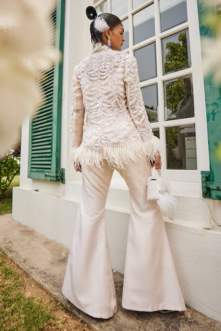 Shop Mani Bhatia Ivory Net, Silk Feathers, Lily Petal Embroidered Jacket And Bell Bottom Pant Set at Aza Fashions Shop_Mani Bhatia_Ivory Net, Silk Feathers, Lily Petal Embroidered Jacket And Bell Bottom Pant Set _at_Aza_Fashions