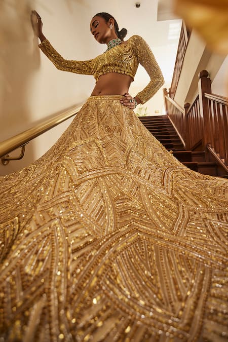 Shop Mani Bhatia Gold Satin, Net Zari, Sequins, Cut Work Cosmic Mirage Embroidered Lehenga Set at Aza Fashions Shop_Mani Bhatia_Gold Satin, Net Zari, Sequins, Cut Work Cosmic Mirage Embroidered Lehenga Set _at_Aza_Fashions
