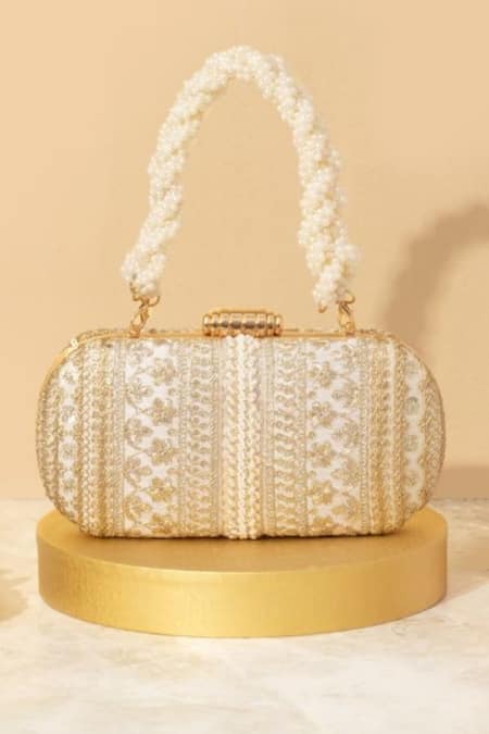 Shop Amyra Off White Embroidery, Sequins, Beads Naaz Flower Capsule Clutch at Aza Fashions Shop_Amyra_Off White Embroidery, Sequins, Beads Naaz Flower Capsule Clutch_at_Aza_Fashions