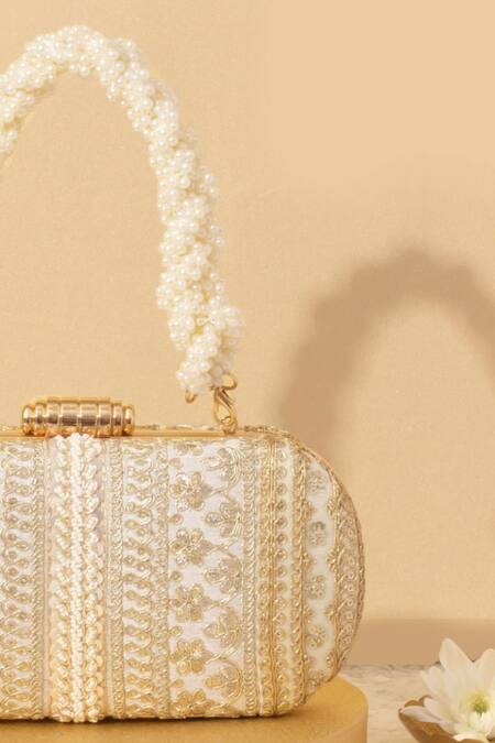 Buy Amyra Off White Embroidery, Sequins, Beads Naaz Flower Capsule Clutch Online at Aza Fashions Buy_Amyra_Off White Embroidery, Sequins, Beads Naaz Flower Capsule Clutch_Online_at_Aza_Fashions