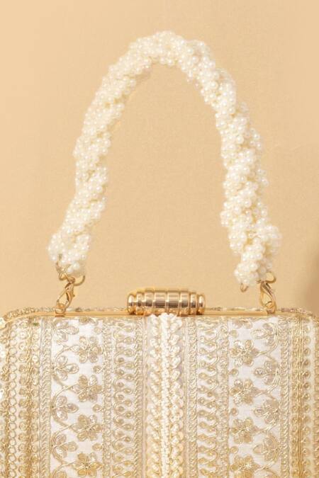Amyra Off White Embroidery, Sequins, Beads Naaz Flower Capsule Clutch at Aza Fashions Amyra_Off White Embroidery, Sequins, Beads Naaz Flower Capsule Clutch_at_Aza_Fashions