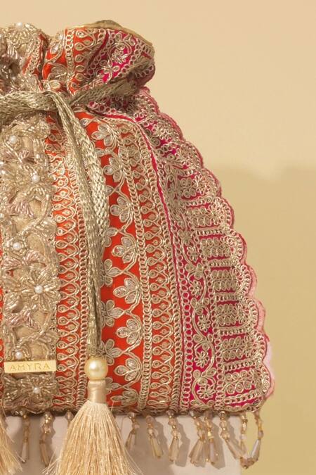 Shop_Amyra_Orange Embroidery, Tassels Naaz Color Block Potli _Online_at_Aza_Fashions