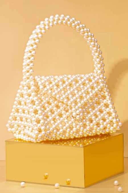 Amyra_Off White Pearls Amelia Triangle Bag_Online_at_Aza_Fashions