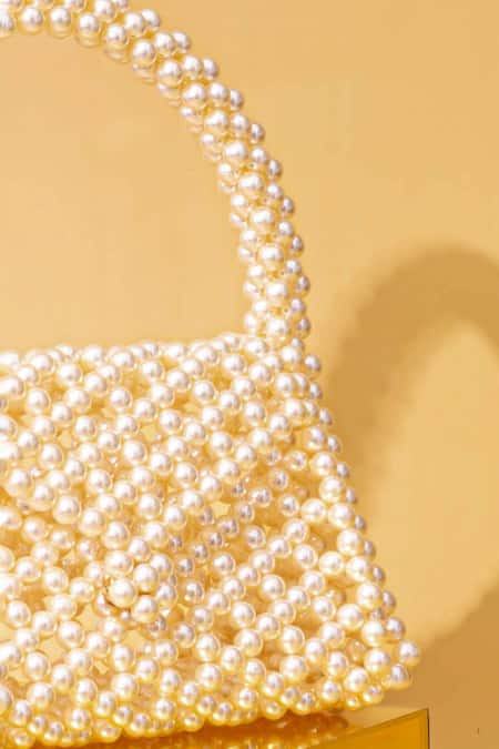 Shop_Amyra_Off White Pearls Amelia Triangle Bag_Online_at_Aza_Fashions