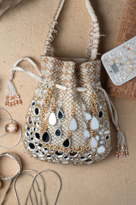 Shop Nayaab By Sonia Ivory Mirrors, Beads, Applique Aaina Jaal Jhaalar Embroidered Potli Bag at Aza Fashions Shop_Nayaab By Sonia_Ivory Mirrors, Beads, Applique Aaina Jaal Jhaalar Embroidered Potli Bag _at_Aza_Fashions