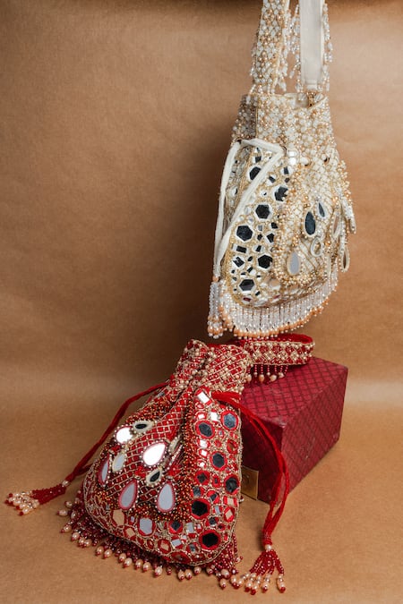 Nayaab By Sonia Ivory Mirrors, Beads, Applique Aaina Jaal Jhaalar Embroidered Potli Bag at Aza Fashions Nayaab By Sonia_Ivory Mirrors, Beads, Applique Aaina Jaal Jhaalar Embroidered Potli Bag _at_Aza_Fashions