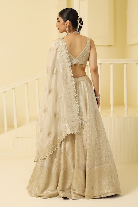Shop Meenagurnam Gold Tissue, Linen Stones, Cut Work, Mirrors, Floral Scallop Pattern Lehenga Set at Aza Fashions Shop_Meenagurnam_Gold Tissue, Linen Stones, Cut Work, Mirrors, Floral Scallop Pattern Lehenga Set _at_Aza_Fashions