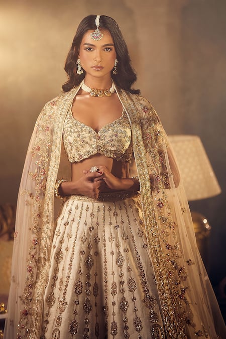 Buy Azeera Ivory Silk Sequins, Zari Plunge Prachi Zardozi Embroidered Bridal Lehenga Set Online at Aza Fashions Buy_Azeera_Ivory Silk Sequins, Zari Plunge Prachi Zardozi Embroidered Bridal Lehenga Set _Online_at_Aza_Fashions