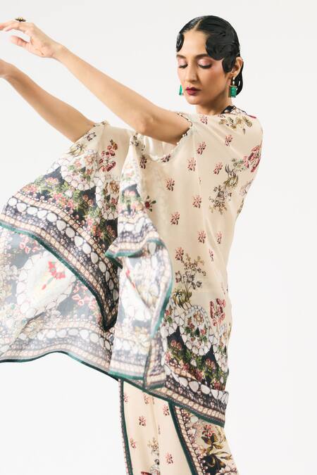 Rajdeep Ranawat_Beige Chloe Floral Print Asymmetric Cape _at_Aza_Fashions