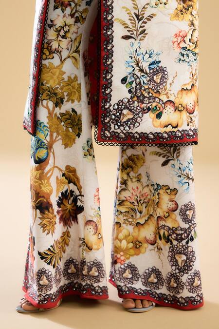 Rajdeep Ranawat_Ivory Polyester, Lycra Barika Floral Print Bell Bottom Pant _at_Aza_Fashions