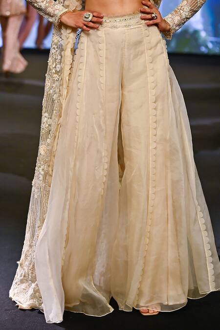 Awigna Ivory Organza, Net Sequins, Lace Italy Fleur Embroidered Jacket And Sharara Set Online at Aza Fashions Awigna_Ivory Organza, Net Sequins, Lace Italy Fleur Embroidered Jacket And Sharara Set _Online_at_Aza_Fashions