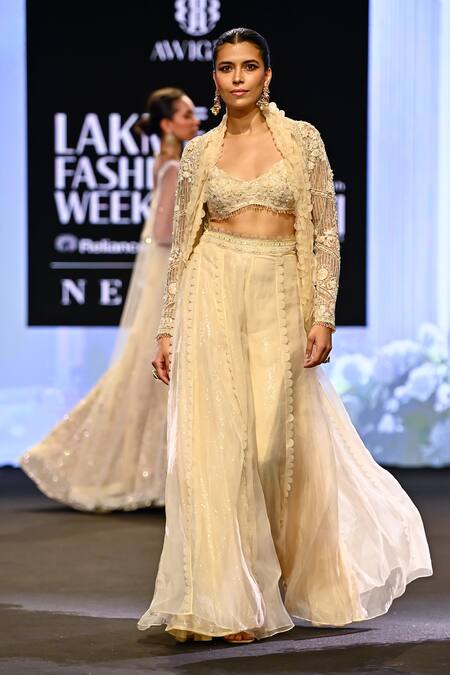 Awigna_Ivory Organza, Net Sequins, Lace Italy Fleur Embroidered Jacket And Sharara Set _at_Aza_Fashions